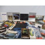 A quantity of Toyota, Suzuki, Honda and Sunbeam brochures and leaflets etc.