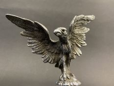 A well-detailed Vintage car accessory mascot in the form of a standing bird of prey with wings