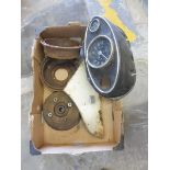 A box of mostly Mini spares including an oval dashboard console with speedometer fitted and brake