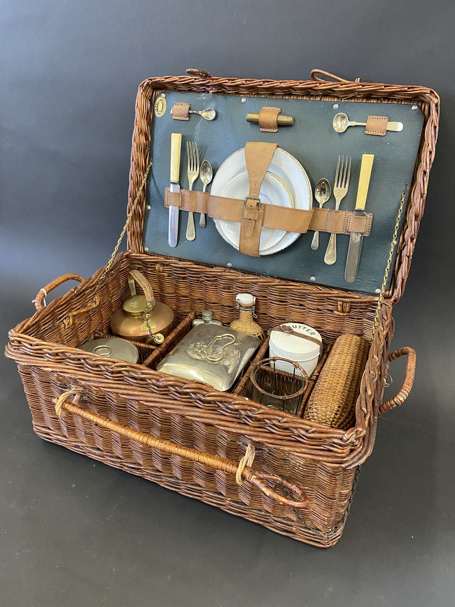 A wicker cased British-made picnic hamper.