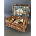 A wicker cased British-made picnic hamper.