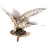 A good quality accesory mascot in the form of an eagle with upturned wings and head raised.