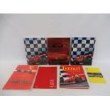 Four Ferrari year books: 2001, 2002 and two copies of 2003, two sealed plus a book titled Ferrari