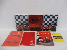 Four Ferrari year books: 2001, 2002 and two copies of 2003, two sealed plus a book titled Ferrari