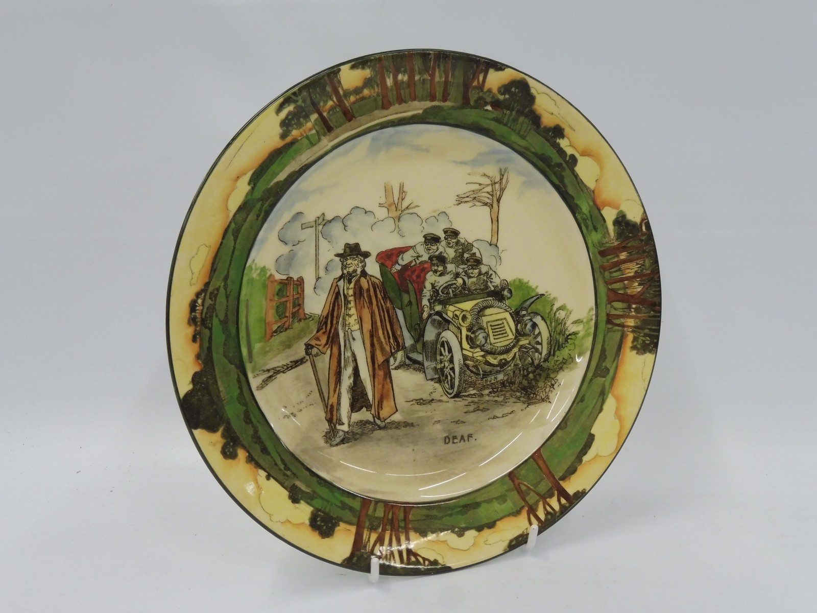 A Royal Doulton motoring themed plate titled 'Deaf', no. D2506.