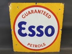 An Esso Guaranteed Petrols enamel sign, cut down from a larger sign, 28 x 28".