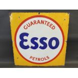 An Esso Guaranteed Petrols enamel sign, cut down from a larger sign, 28 x 28".