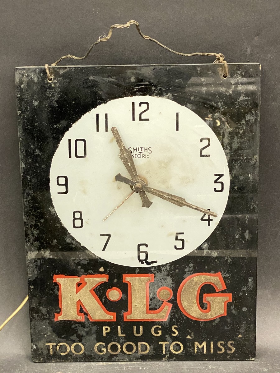 A KLG glass fronted advertising wall clock by Smith Sectric, original movement.