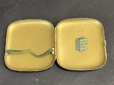 A Pratt's Perfection Spirit promotional cigarette case with two gallon petrol can to the inside.