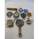 A box of assorted car badges including Evesham Auto Club, West Riding Squadron Royal Auxiliary Air