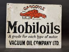 A Gargoyle Mobiloils double sided enamel sign, lacking hanging flange, bearing the unusual words '