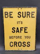 A cast aluminium road sign 'Be Sure it's Safe Before You Cross' with maker's mark Thetford,