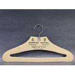 An RAC/AA approved Corrie Hotel Swanage, Dorset cardboard coathanger, appears unused.