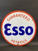 An Esso Guaranteed Petrols circular double sided enamel sign in very good condition, 30" diameter.