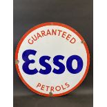 An Esso Guaranteed Petrols circular double sided enamel sign in very good condition, 30" diameter.