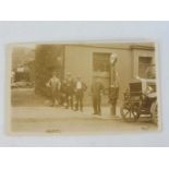 An original postcard depicting an early garage scene with a Gilbert & Barker T8 petrol pump beside