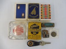 A box of mixed motoring collectables including branded playing cards (Vigzol, Rolls Royce etc.) plis