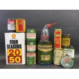 A box of assorted grease and oil tins.