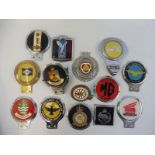 A shallow box of car badges including The Pathfinder Club, Cornwall County Fire Brigade etc.