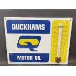 A Duckhams Motor Oil enamel thermometer by Burnham of London, in very good condition, 26 x 20".