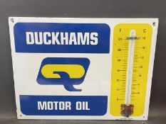 A Duckhams Motor Oil enamel thermometer by Burnham of London, in very good condition, 26 x 20".