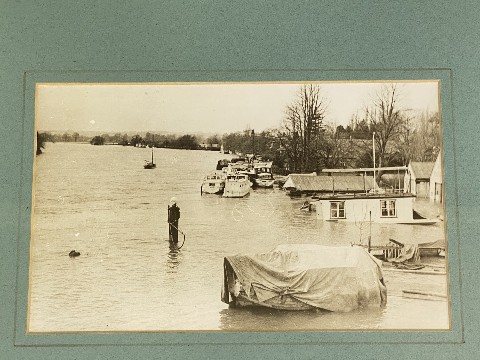 A framed and glazed photograph of a 1920s petrol pump, probably an Avery Hardoll or Vickers, in situ