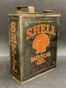 A Shell Motor Oil rectangular gallon can.