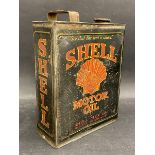 A Shell Motor Oil rectangular gallon can.