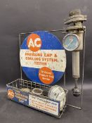 An AC Pressure Cap & Cooling System Tester on original rack with accessories.
