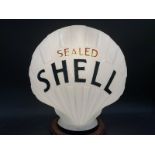 A Sealed Shell glass petrol pump globe, stamped underneath 'Property of Shellmex Ltd. Returnable