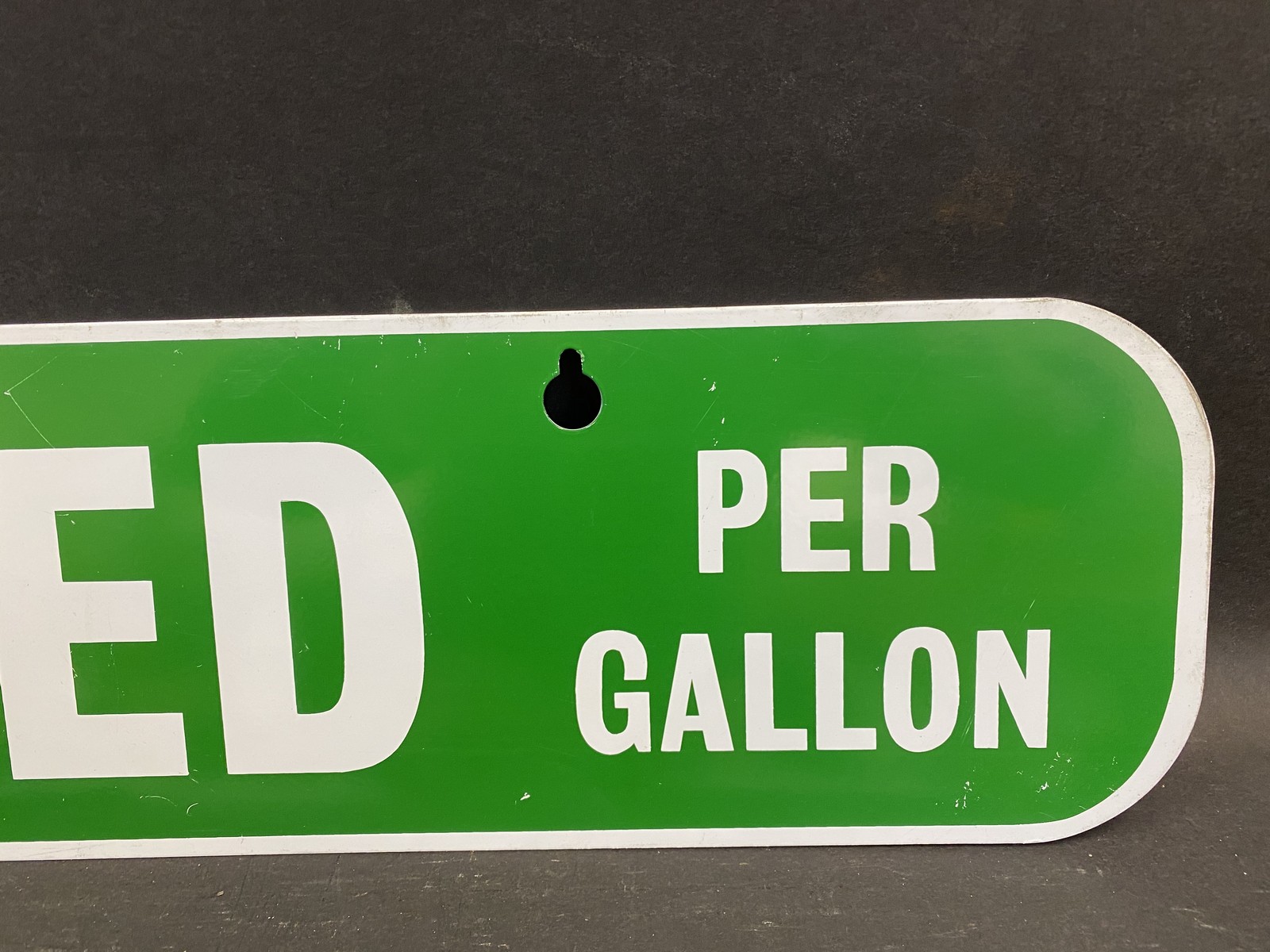 An Unleaded 'per gallon' rectangular tin sign, in very good condition, 30 x 6". - Image 2 of 3