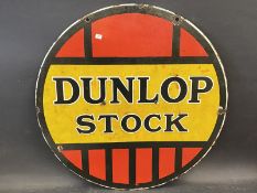 A Dunlop Stock circular double sided enamel sign, 24" diameter.