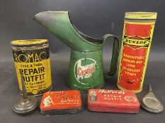 A Castrol pint measure, four repair outfit tins and two oilers.