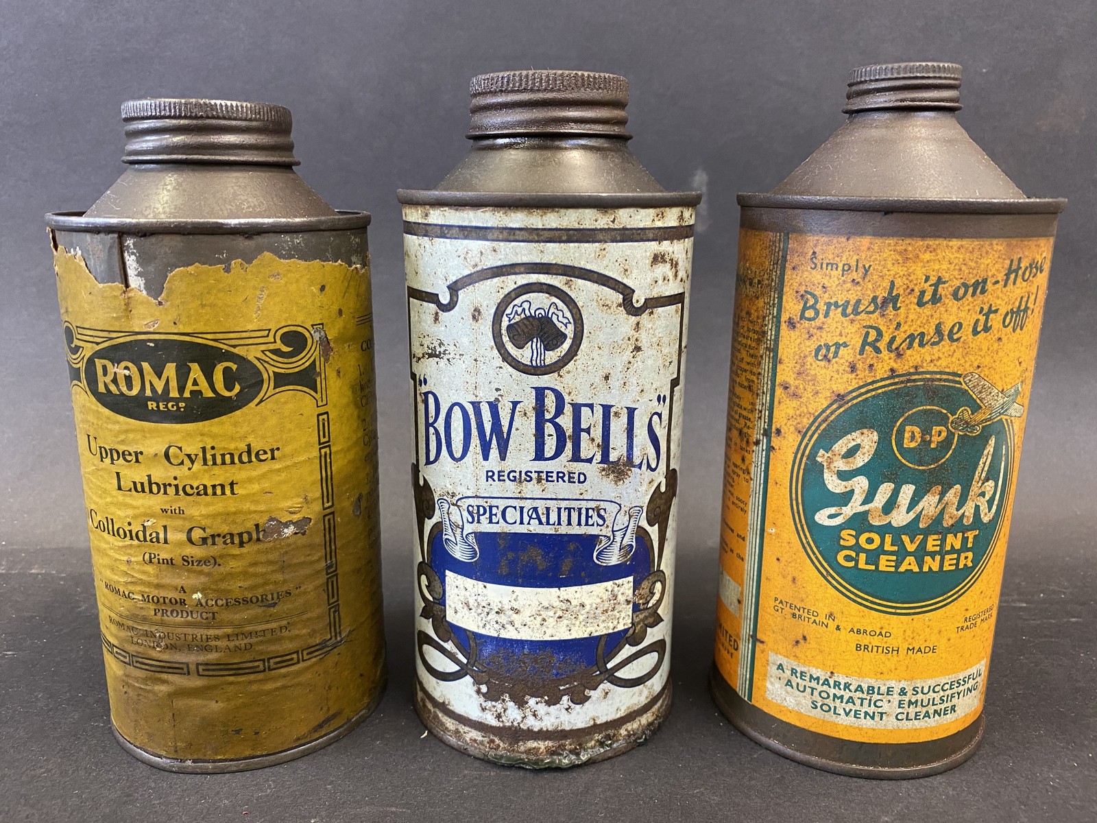 Three cylindrical pint oil cans including BowBells and Romac.