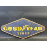 A Goodyear Tires lozenge shaped tin advertising sign, 30 x 14".