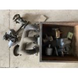 A box of Lagonda 2 litre parts including low chassis carburettor and exhaust manifold.