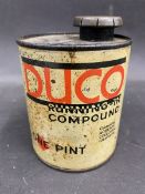 A Duco running-in compound cylindrical tin.