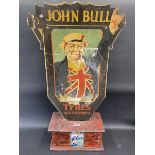 An early and rare John Bull Tyres and Accessories painted wooden die-cut sign, resting in a newly