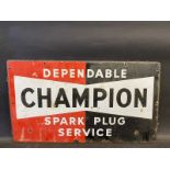 A 'Dependable Champion Spark Plug Service' rectangular enamel sign, dated 1951, 23 x 13".