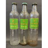 Three BP Energol Motor Oil quart glass bottles with caps.