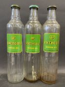 Three BP Energol Motor Oil quart glass bottles with caps.