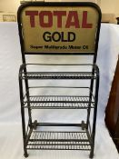 A Total Gold garage forecourt oil bottle trolley.