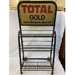 A Total Gold garage forecourt oil bottle trolley.