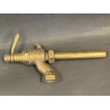A bronze petrol pump nozzle, type AF.