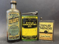 A Spur Cycle Lubricating Oil oval can, a Spur Minor Petrol light can and a Spur Cycle Cleaning &