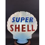 A blue Super Shell glass petrol pump globe by Hailware, fully stamped underneath 'Property of