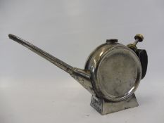 An unusual circular British made oiler.