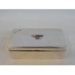 A silver plated rectangular cigarette box with applied Bentley badge to the top.