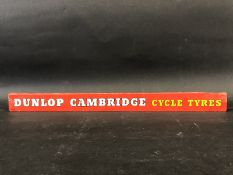 A Dunlop Cambridge Cycle Tyres shelf strip.
