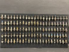 A superb collection of 96 spark plugs mounted on a display board including many rare plugs small